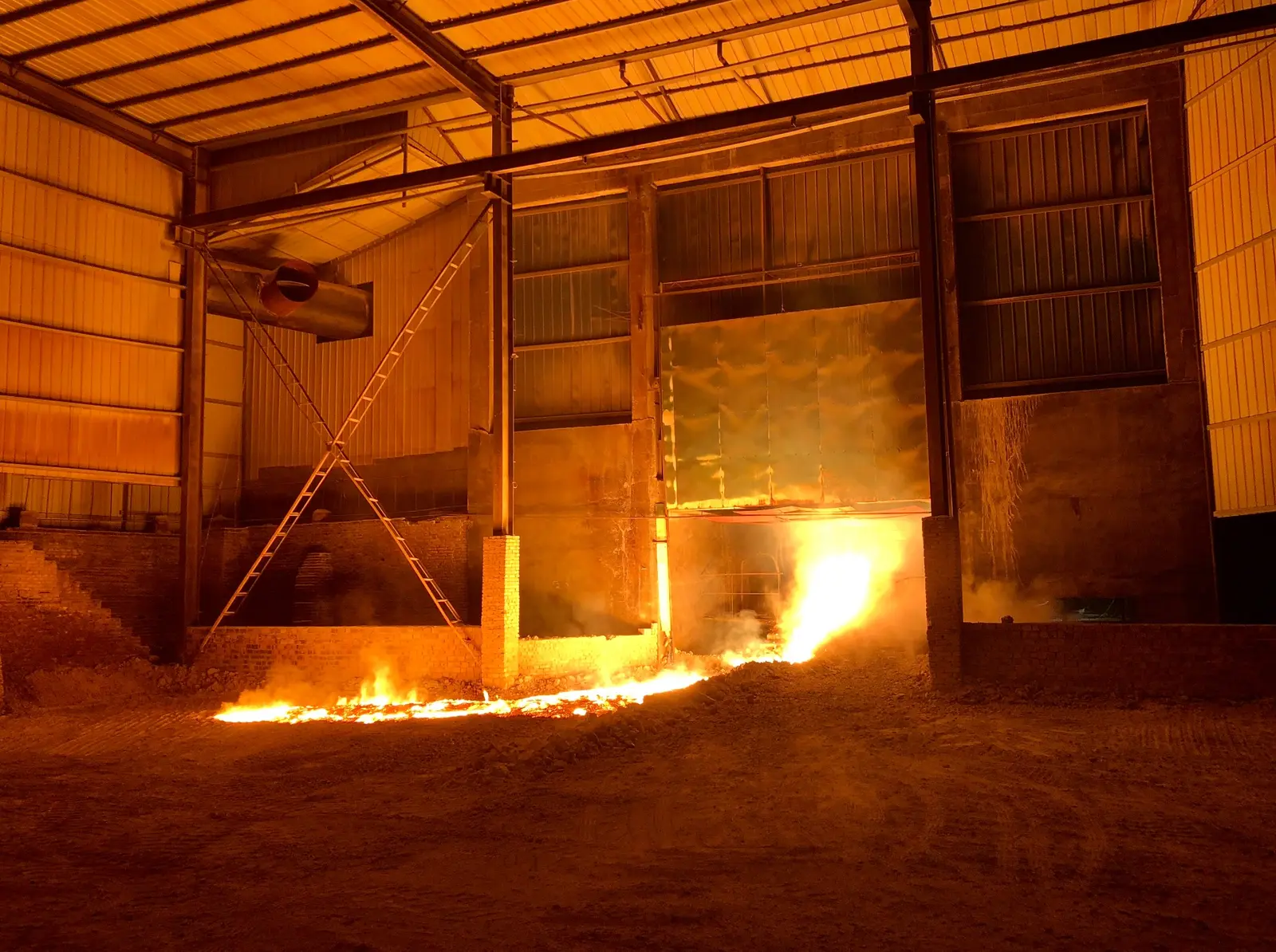 High-temperature carbon material production inside a furnace workshop
